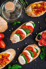 Bruschetta with tomatoes, mozzarella and basil