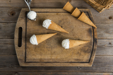 Obraz na płótnie Canvas creamy vanilla ice cream in preparation with rustic background a