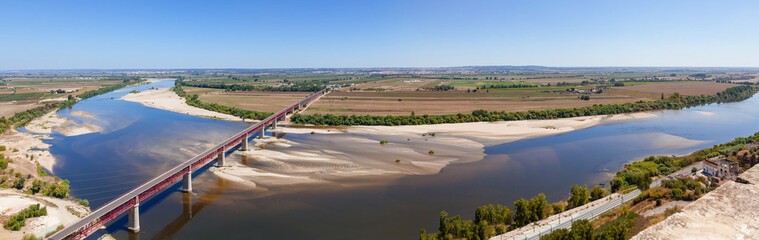 Santarem, Portugal. Dom Luis I Bridge crossing the Tagus River (Rio Tejo), the largest of the Iberian Peninsula, with the Leziria landscape seen from Portas do Sol belvedere.