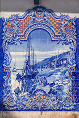 Typical Portuguese Azulejos (Blue tiles) depicting typical regional scenes, in the facade of the 19th century Municipal Market of Santarem, Portugal.