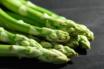 delicious asparagus on wooden black background. Horizontal view