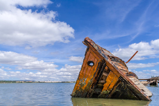 Sunken wooden ship in Seixal Bay (Tagus River),near Lisbon. Portugal.