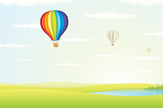 Hot Air Balloon over Green Fields. Image