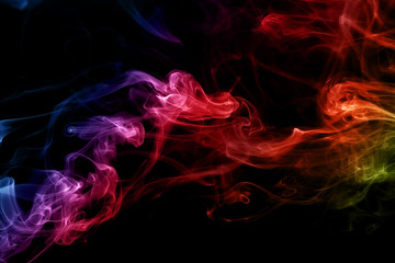 Fototapeta premium Colored abstract smoke, isolated on black background. Photo. Neon.