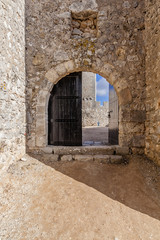 Open gate of the Sesimbra castle, Portugal.