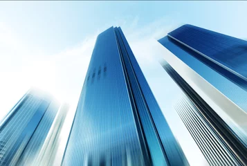 Photo sur Plexiglas construction de la ville look up modern office building in cloud sky