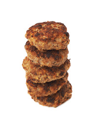 Stack of small hand made cutlets isolated over white background