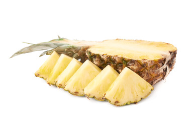 Slices with whole pineapple isolated over white background
