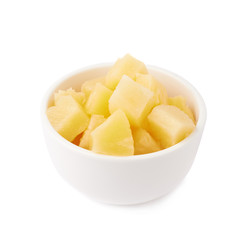Pile of canned pineapple over isolated white background