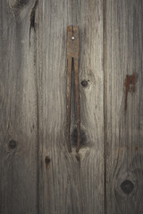 Rusty and grungy old tool on dark wood background