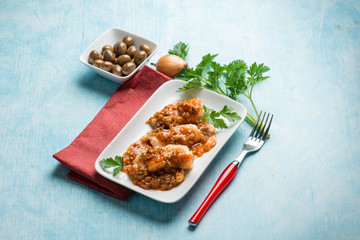 cod fillet with  olives and  tomatoes sauce
