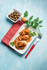 cod fillet with  olives and  tomatoes sauce