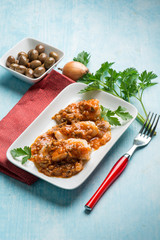 cod fillet with  olives and  tomatoes sauce