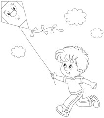 Little boy flying a kite