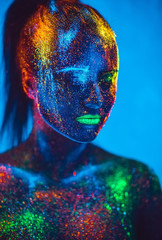 Girl colored fluorescent powder.
