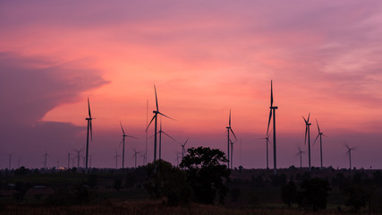 Obraz premium Wind turbine power generator at twilight