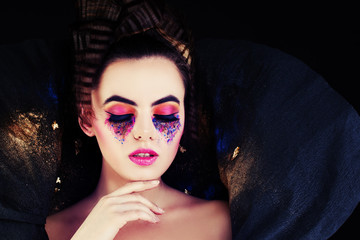 Fashionable Woman. Model with Creative Makeup and Hairstyle