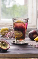 Cocktail of lime, lemon,kumquat,blackberries with ice