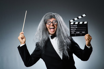 Funny man with movie clapboard