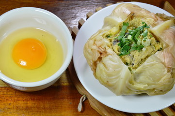 steamed egg with mushroom in cabbage and yolk on cup