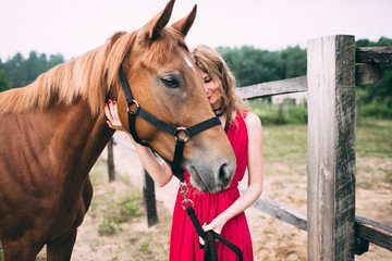 Fototapeta premium happy woman enjoys with her favorite horse