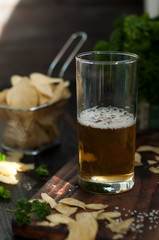 Mug of beer on wooden background