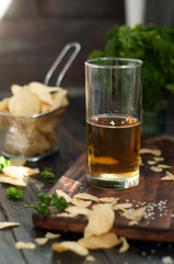 Mug of beer on wooden background