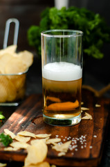 Mug of beer on wooden background