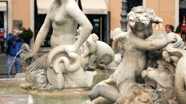 Detail of fountain of the Four River (di Quatro Fiumi) in Piazza Navona in Rome, super slow motion
