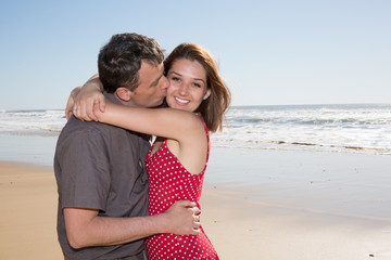 Man kissing his love at the beach, romance