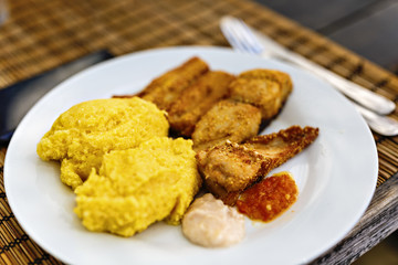 fried fish with polenta and garlic sauce