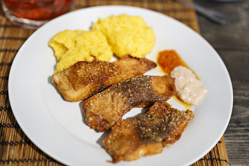 fried fish with polenta and garlic sauce