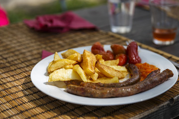 peasant sausage with fries and red pepper