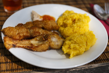 fried fish with polenta and garlic sauce