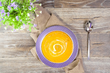 Vegetable soup on the wooden background. Rustic style
