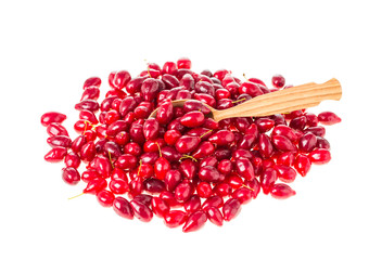 Ripe dogwood berries and wooden spoon.