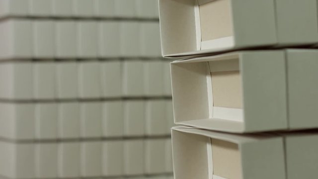 Stack of white rectangular boxes. Empty blank paper boxes. Containers of simple design. Environmentally friendly material.