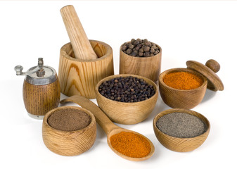 spices and seasoning in wooden bowl on white background