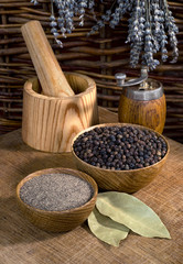 black pepper and wooden utensils on the wooden table