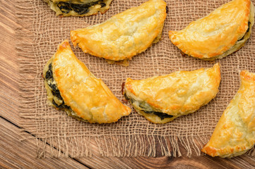 Puff pastries with spinach and cheese.