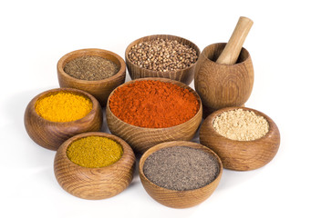 spices and seasoning in wooden bowl on white background