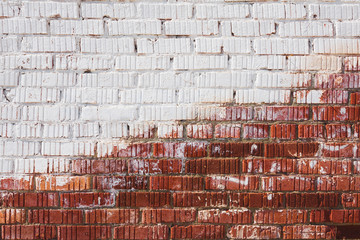 Wall made of red and white bricks. Texture, background