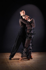 dancers in ballroom isolated on black background