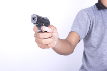 hand holding gun selective focus