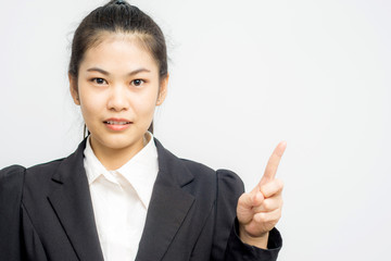 Portrait of beautiful young woman pointing finger