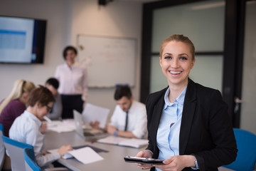 business woman working on tablet at meeting room