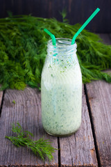 Cool Green kefir in bottle, selective focus