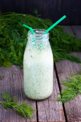 Cool Green kefir in bottle, selective focus