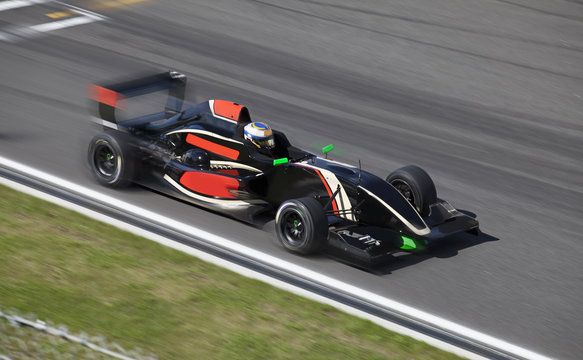 Formula 2 race car on a speed track with motion blur