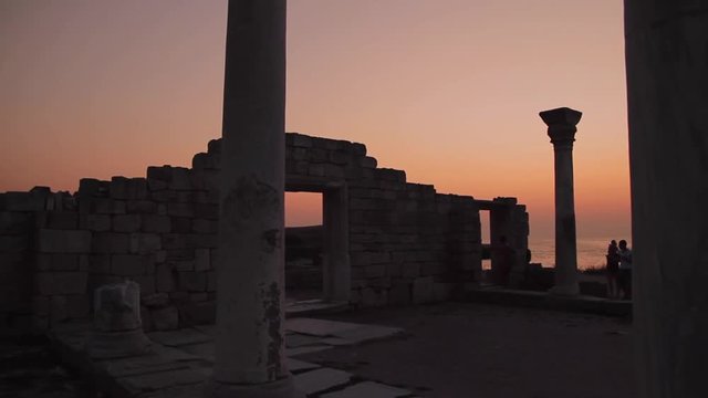The 1935 Basilica silhouette at sunset with sea view in Chersonesos, Crimea, Ukraine. Ruins view at dusk. Handheld shot. 